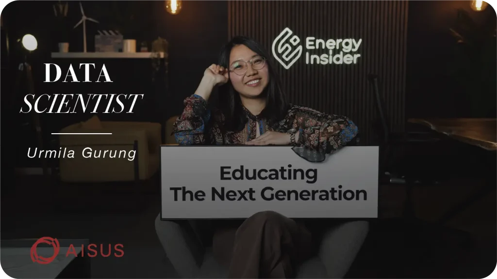 A data scientist is smiling at the camera